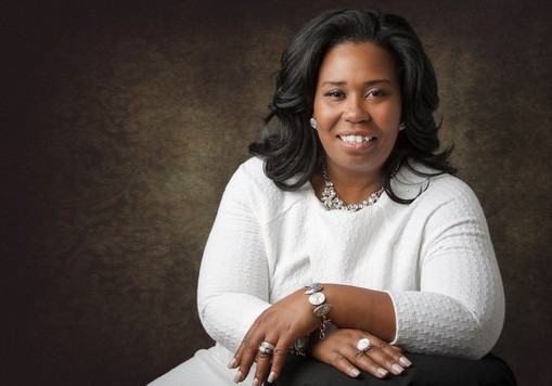 Portrait of Apostle Omyni Harrell, Founder and CEO of Wealth Builders Kingdom