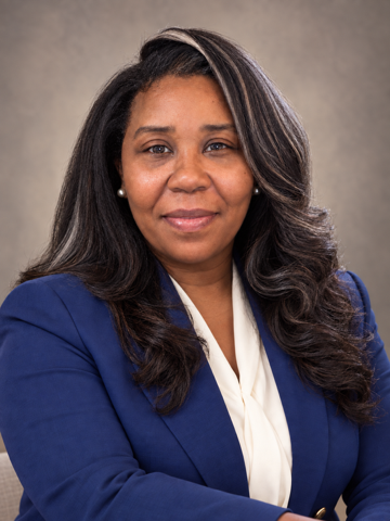 Portrait of Apostle Omyni Harrell, Founder and CEO of Wealth Builders Kingdom
